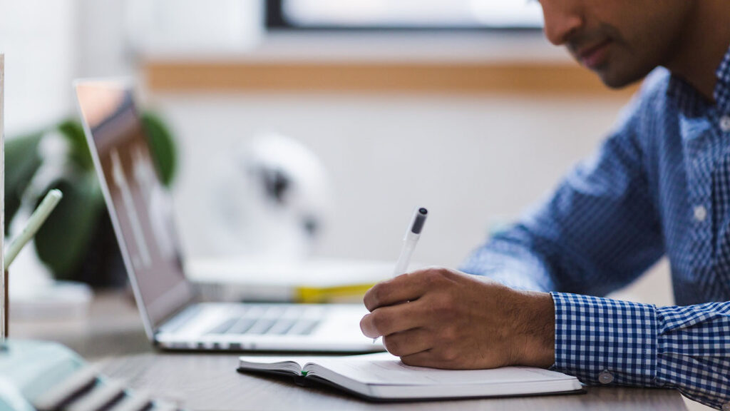 Person completing a cannabis application on their computer.