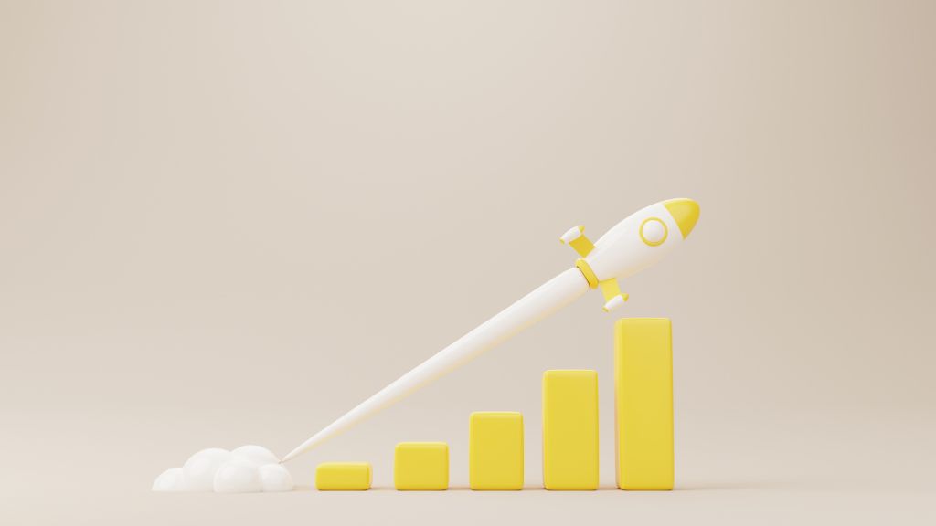 A vertical bar graph with increasing bars and a rocketship illustrating growth, symbolizing when it's time to hire a cannabis consultant for your cannabis startup or cannabis facility design.
