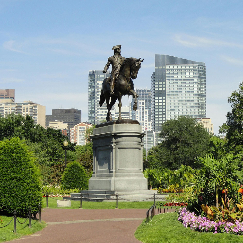 A statue of a man on a horse in a Boston park, representing leadership and vision in Massachusetts cannabis consulting.