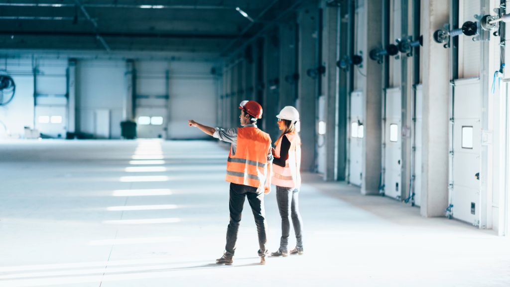 New York Cannabis Consulting experts discussing New York cannabis design in an unfinished facility