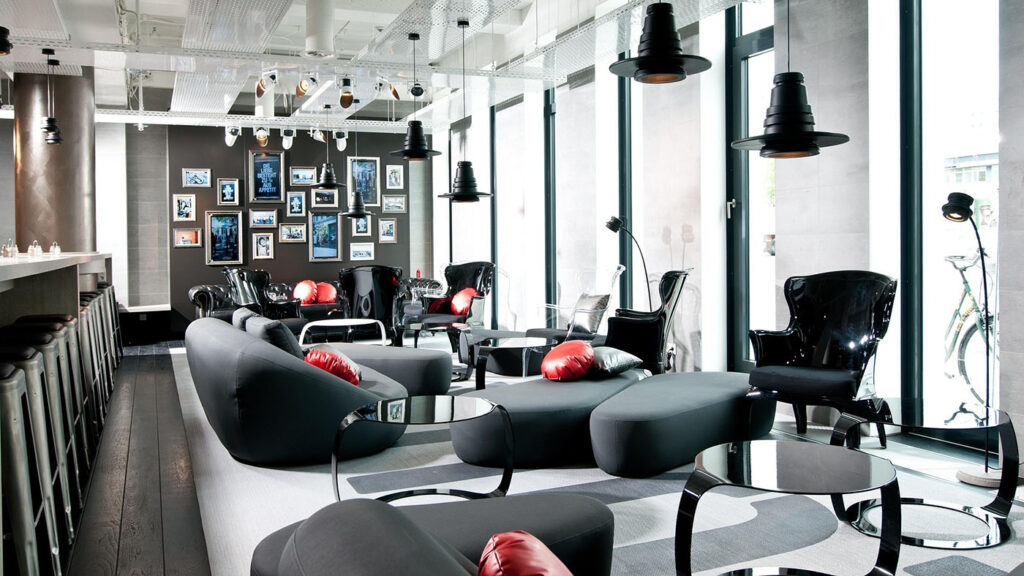 Interior of a modern, brightly lit cannabis consumption lounge with seating