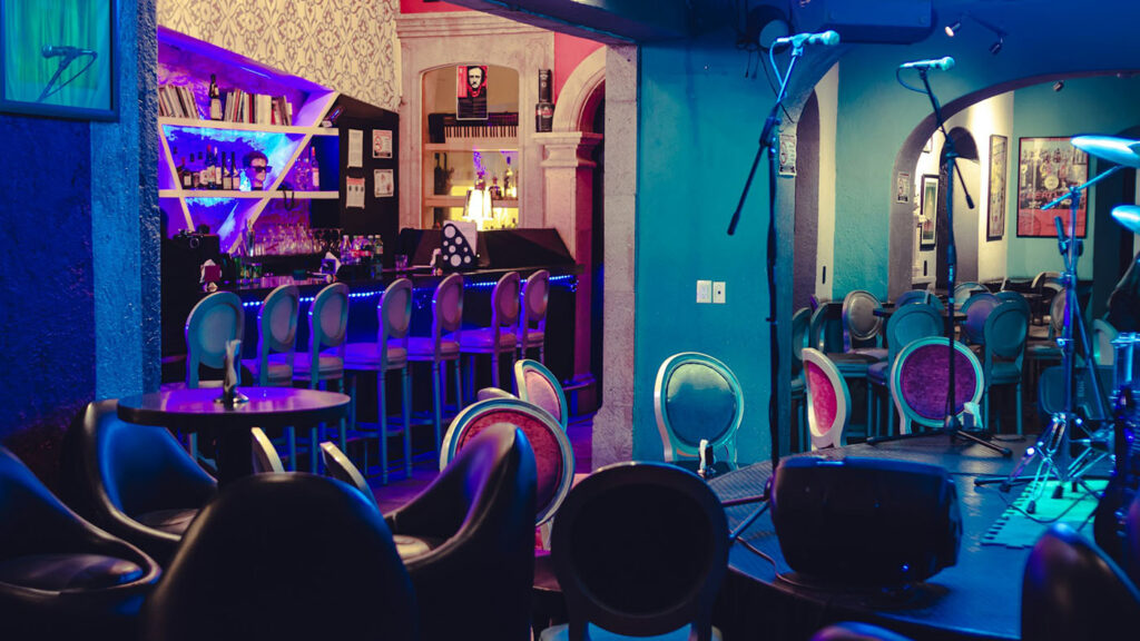 Interior of a modern Massachusetts cannabis lounge with sleek seating and proper ventilation