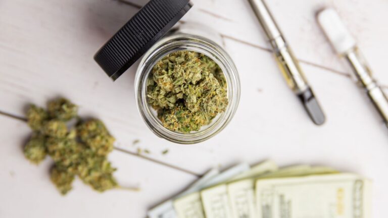 Minnesota cannabis microbusiness product display with vape pens and flower, highlighting cannabis compliance and consulting strategies.