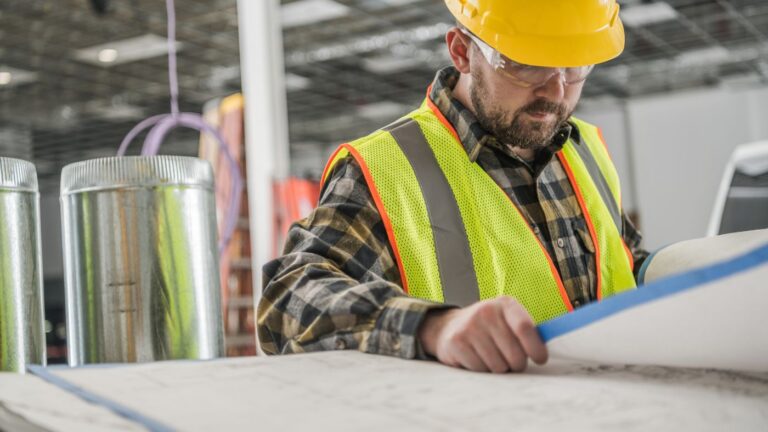 Cannabis HVAC design consultant reviewing blueprints for cannabis facility engineering and indoor air quality in cannabis facilities.