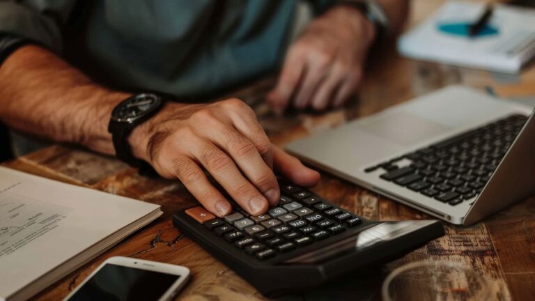A specialized accountant calculating COGS for complex Cannabis 280E Compliance IRS paperwork, utilizing Cannabis Cost Segregation to optimize deductions.