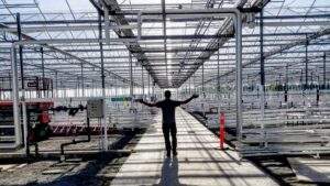 Michael Williamson of Catalyst BC in the aisle of a Virginia cannabis cultivation facility under construction.